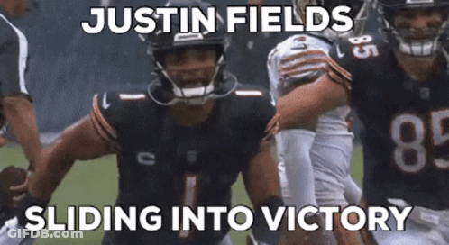 Football Player With Justin Fields Sliding Into Victory GIF