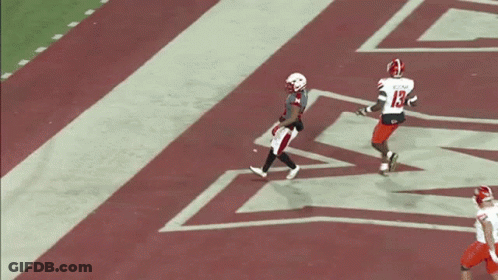 Football Player With Letter M On Jersey Holding Ball GIF