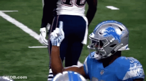 Football Player With Lion Helmet High-Fiving Another Player GIF