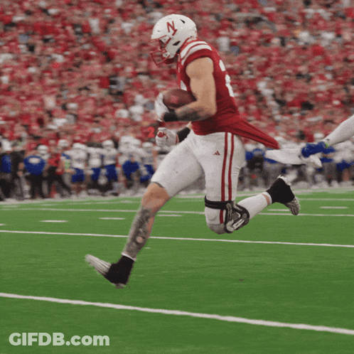Football Player With N Helmet Running With Ball GIF