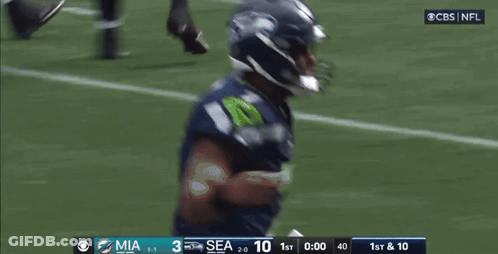 Football Player With Touchdowns Background GIF