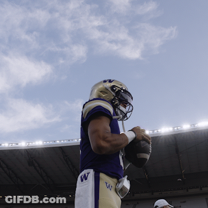 Football Player With W On Shorts Holding Ball GIF