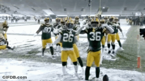 Football Players 26 And 36 On Snowy Field GIF