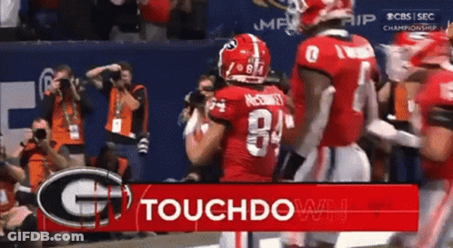 Football Players At Touchdown Sign GIF