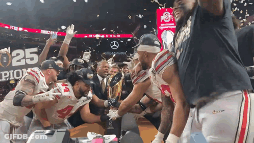 Football Players Celebrating Trophy With 25 Sign GIF