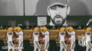 Football Players Dancing In Front Of Man Portrait GIF