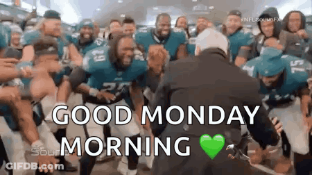 Football Players Dancing In Front Of Suited Man GIF