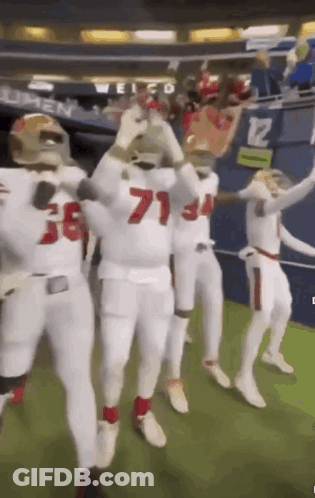 Football Players Dancing In Stadium GIF