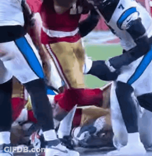 Football Players Fighting On Field GIF