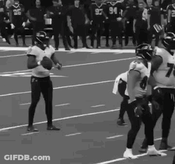Football Players Holding Ball GIF
