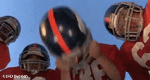 Football Players Holding Helmets Up GIF