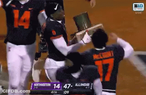 Football Players Holding Trophy In Stadium GIF