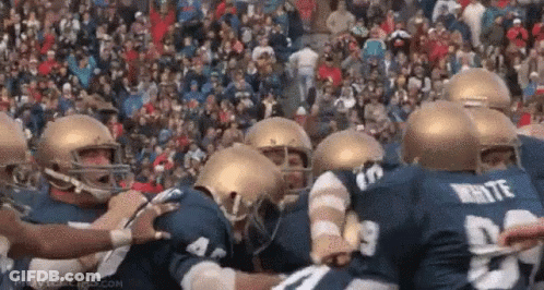 Football Players Huddle GIF