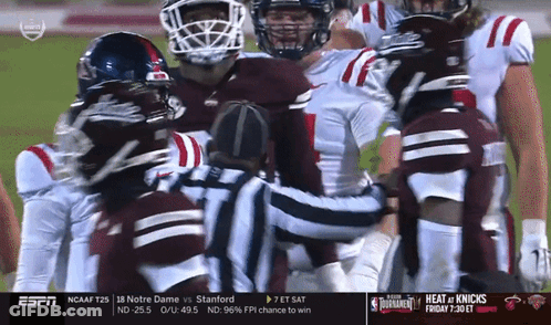 Football Players Huddle Around Referee ESPN GIF