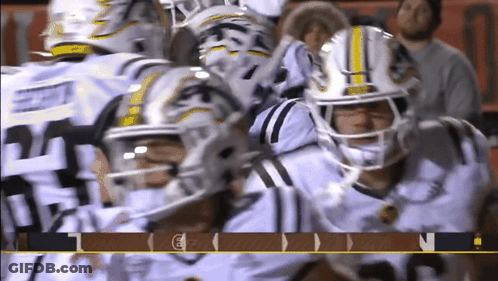 Football Players Huddled Number 21 GIF