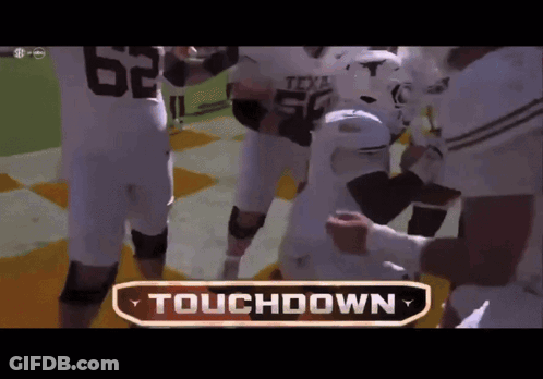 Football Players Huddled Saying Touchdown GIF