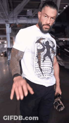 Football Players Huddled Together Saying Touchdown GIF