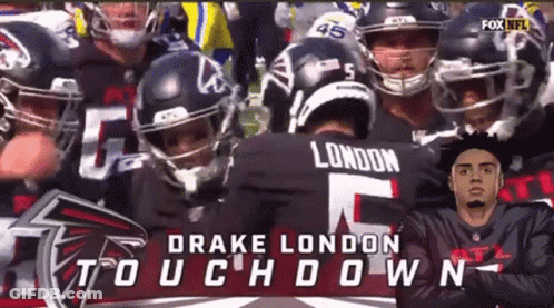 Football Players Huddled With Drake London GIF