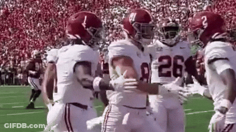 Football Players Hugging On Field GIF