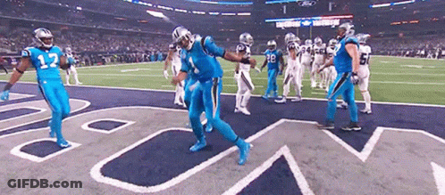 Football Players In Blue Uniforms Dancing On Field GIF