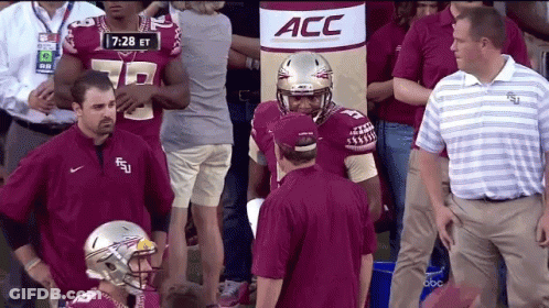 Football Players In Front Of ACC Banner GIF