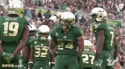 Football Players In Green Uniforms Bullpen GIF