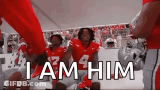 Football Players In Huddle Saying I Am Him GIF