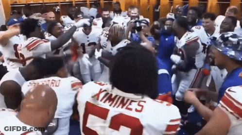 Football Players In Locker Room With Number 52 Jersey GIF