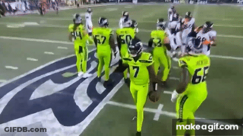 Football Players In Neon Green Uniforms GIF