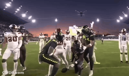 Football Players In Number 30 Jersey On Field GIF
