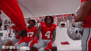 Football Players In Red Jerseys Number 4 GIF