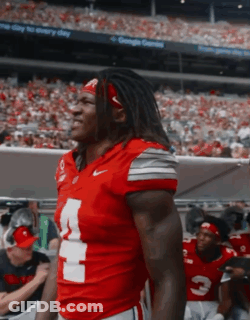 Football Players In Red Jerseys With Number 7 GIF