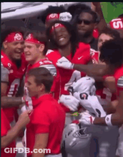 Football Players In Red Jerseys With Number 7 GIF