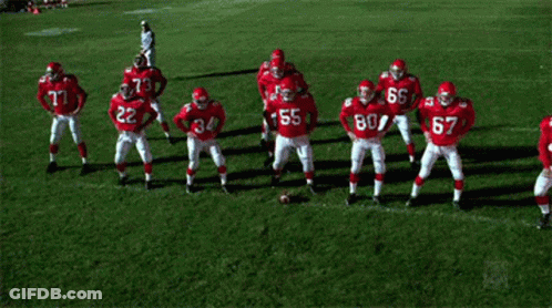 Football Players In Red Uniforms Number 55 GIF