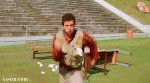 Football Players Lined Up On Field GIF
