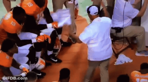 Football Players Listening To Coach In Locker Room GIF