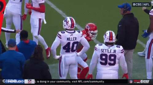 Football Players Miller 40 And Settle Jr 99 On Field GIF