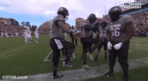 Football Players Number 66 On Field GIF
