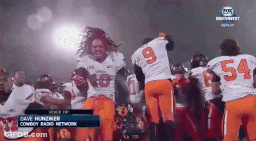 Football Players Number 9 And 54 On Field GIF
