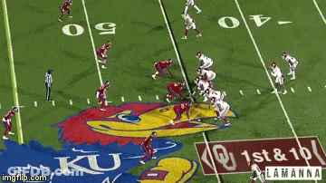 Football Players On A Field With A Ku Logo GIF