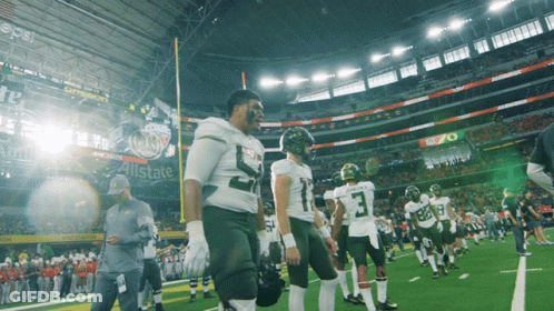 Football Players On Field In Front Of Pepsi Ad GIF