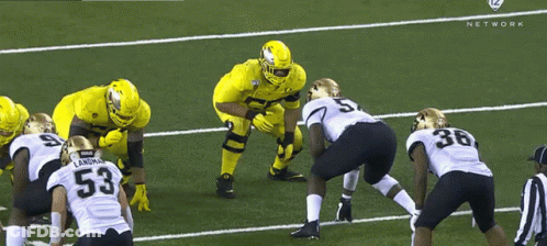 Football Players On Field Including Number 53 GIF