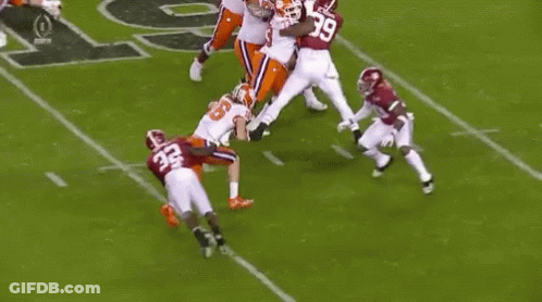 Football Players On Field One Kneeling GIF