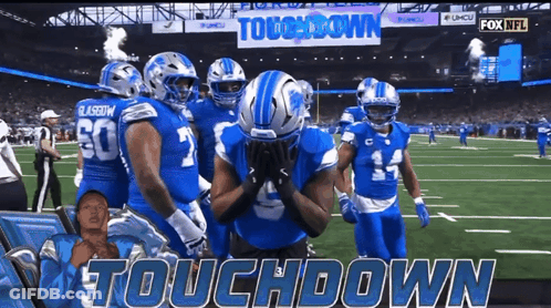 Football Players On Field Saying Touchdown GIF