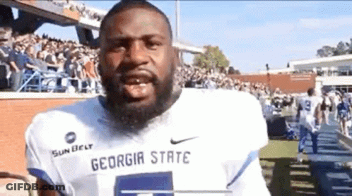 Football Players On Field With Crowd GIF