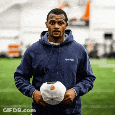 Football Players On Field With Let's Gooooo Banner GIF
