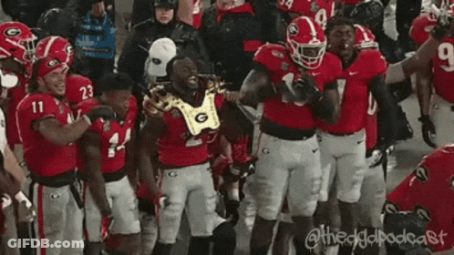 Football Players On Field With Number 10 Jersey GIF