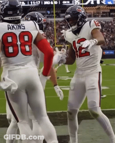 Football Players On Field With Number 12 GIF