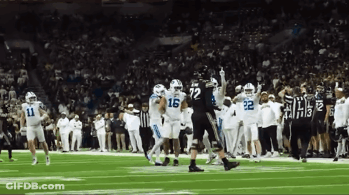 Football Players On Field With Number 16 Jersey GIF