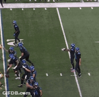 Football Players On Field With Number 18 Jersey GIF